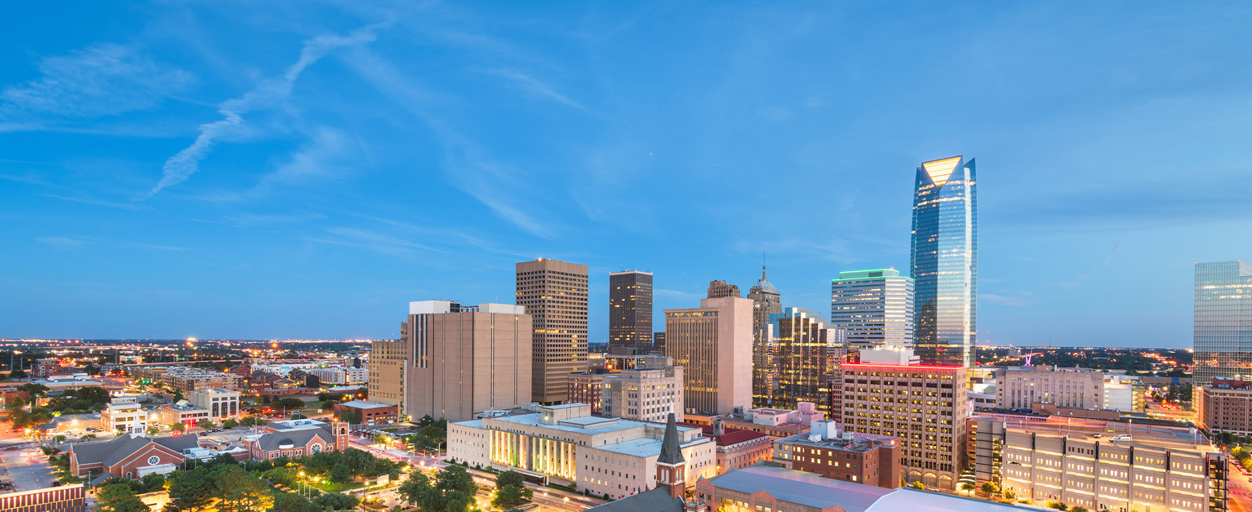 An photo of the skyline of downtown Oklahoma City at dusk